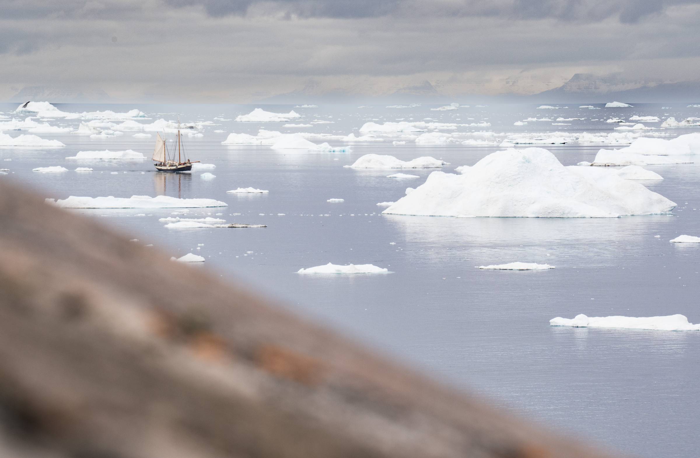 The Northwest Passage! A tall ship looks tiny agains the ice floes