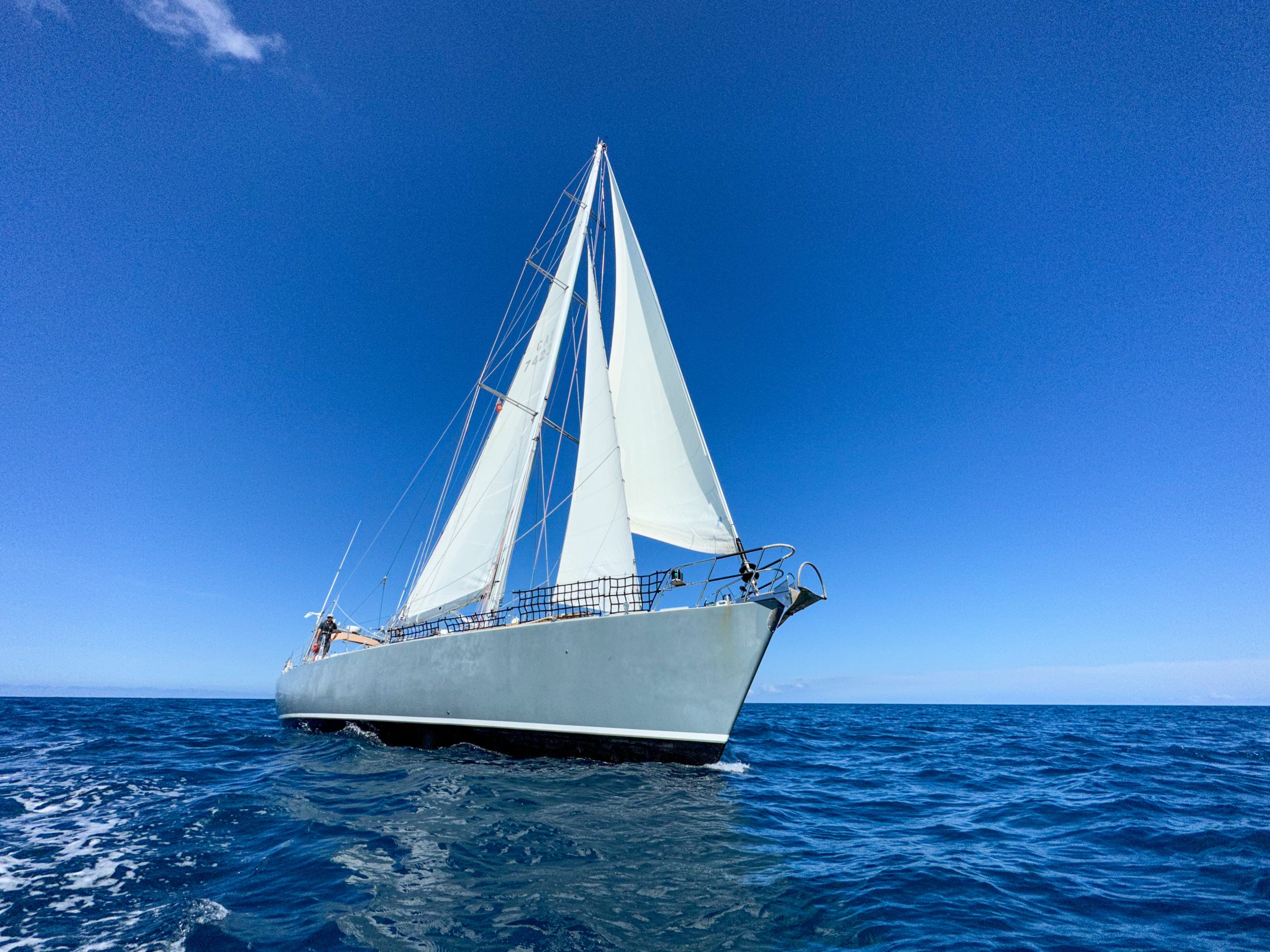 A sailing yacht that looks like it's about to sail over the camera!