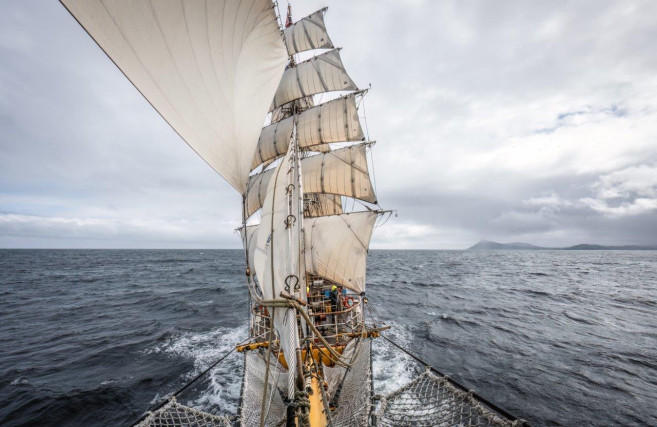 An impressive tall ship under full sail